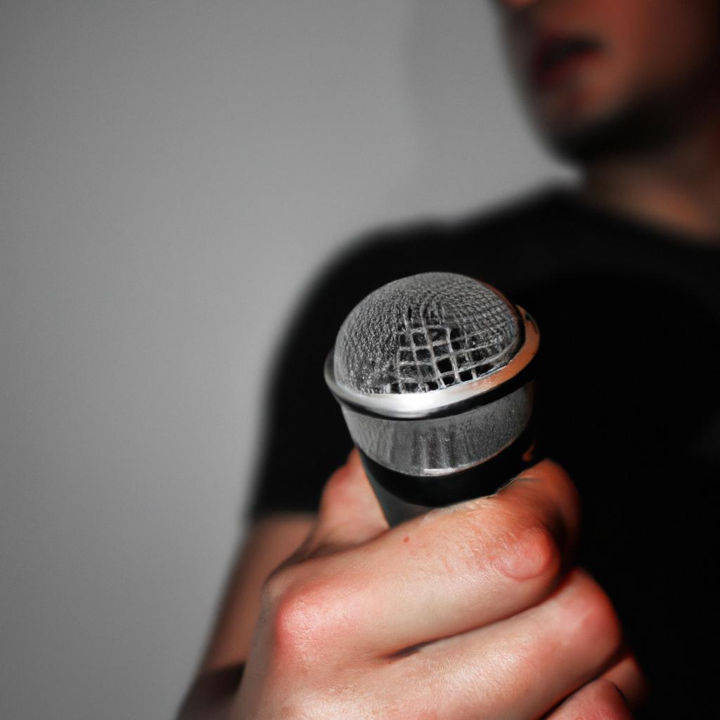 Person holding a microphone, singing